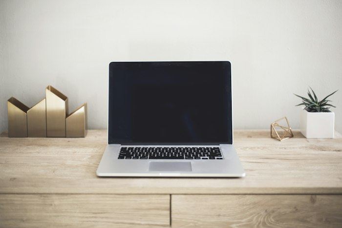 Open laptop on a wooden desk
